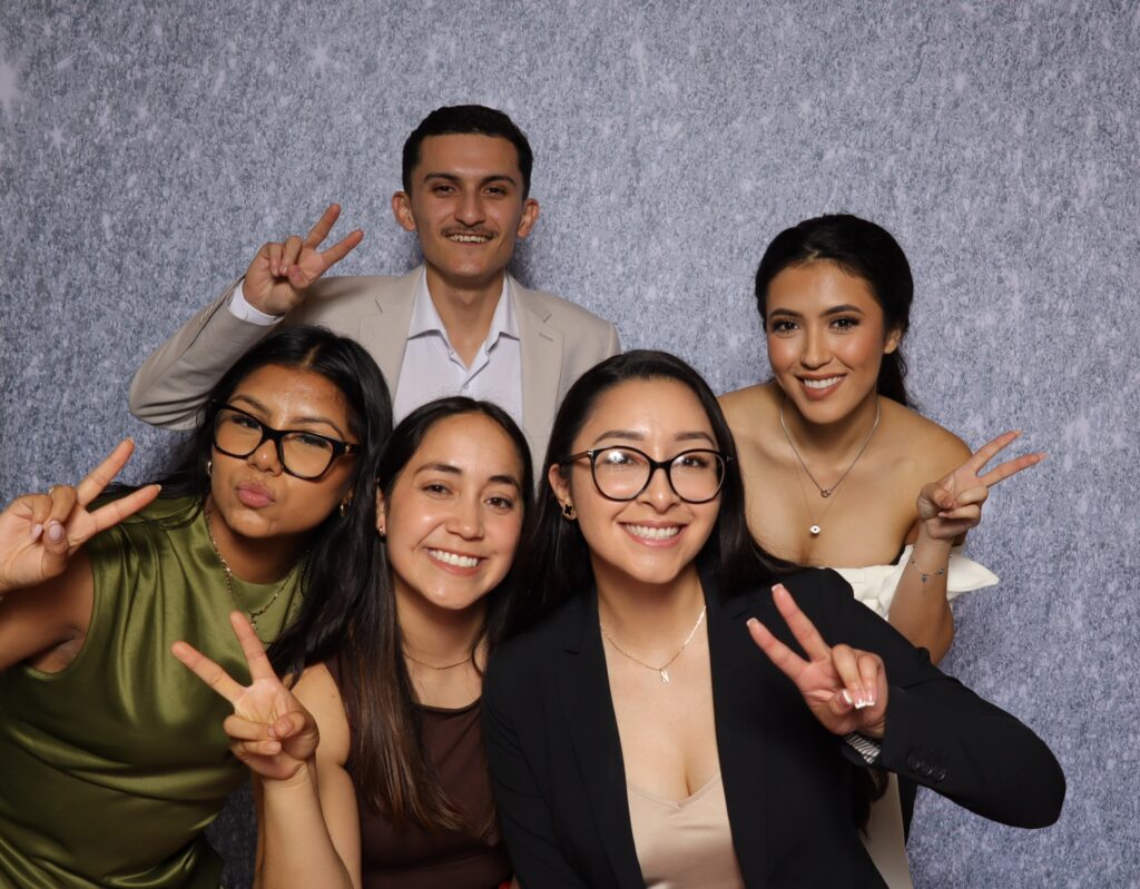 Group of professionals enjoying photo booth experience at Dallas Photo Booth Collab event.