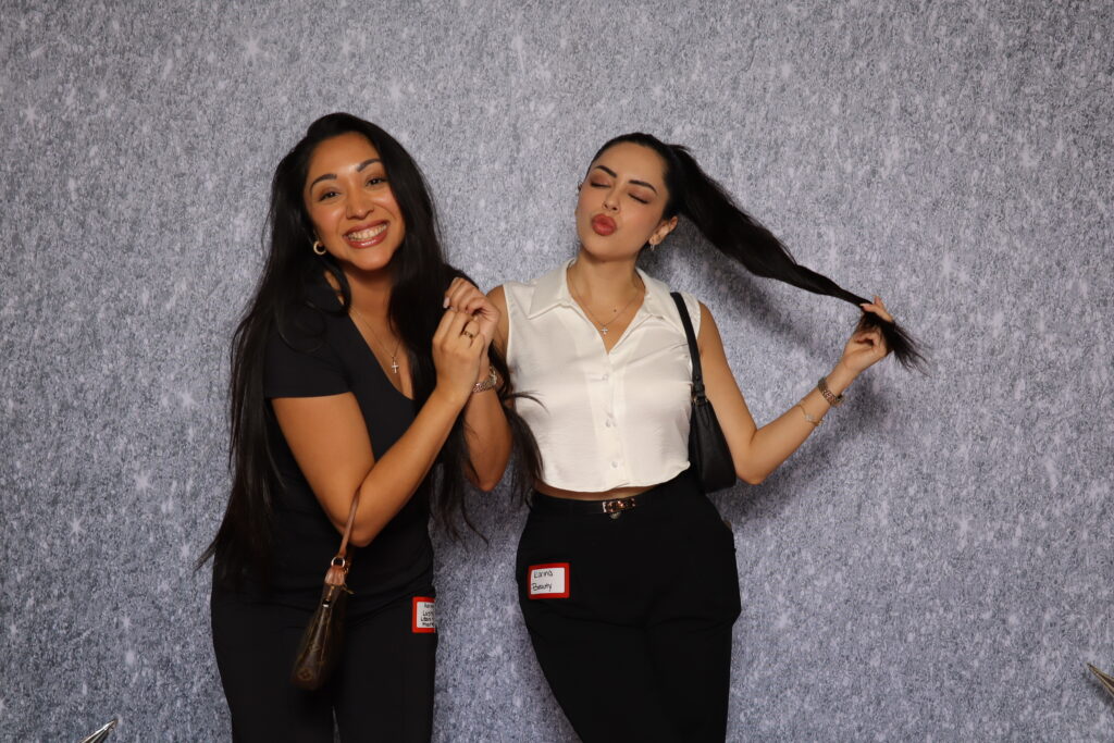 Guests smiling and enjoying themselves at a Dallas photo booth networking event.